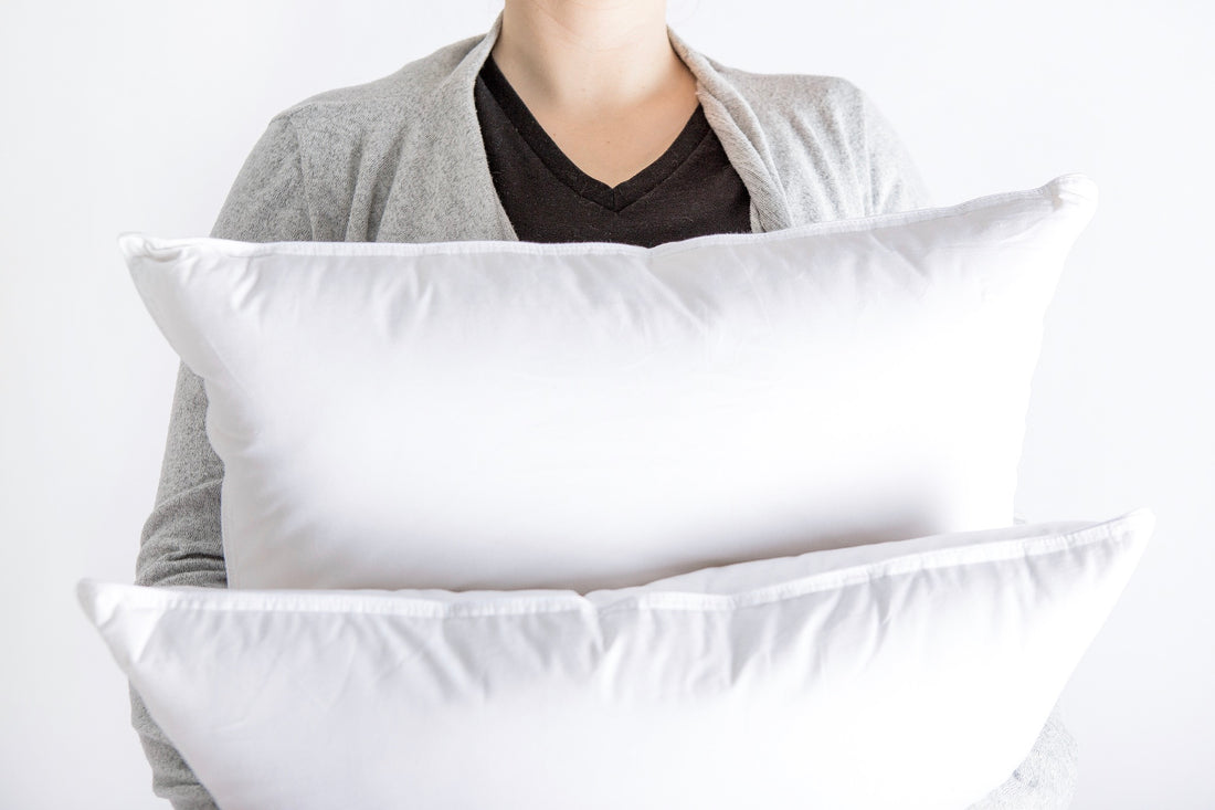 woman holding pillows